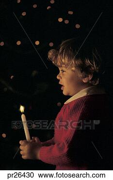 Stock Photography - boy holding a 
candle. fotosearch 
- search stock 
photos, pictures, 
images, and photo 
clipart