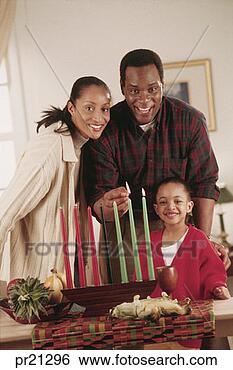 Stock Photo - family celebrating 
kwanzaa, portrait. 
fotosearch - search 
stock photos, 
pictures, images, 
and photo clipart