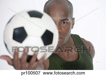 Picture - man holding soccer 
ball. fotosearch 
- search stock 
photos, pictures, 
images, and photo 
clipart