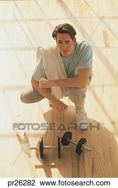 Stock Photo - man kneeling after 
workout, portrait. 
fotosearch - search 
stock photos, 
pictures, images, 
and photo clipart
