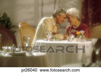 Stock Photography - older couple at 
dinner table. 
fotosearch - search 
stock photos, 
pictures, images, 
and photo clipart