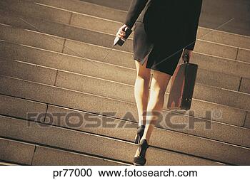 Stock Photography - businesswoman 
walking up stairs. 
fotosearch - search 
stock photos, 
pictures, images, 
and photo clipart