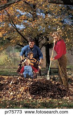 Stock Photo - family with pile 
of leaves outside. 
fotosearch - search 
stock photos, 
pictures, images, 
and photo clipart