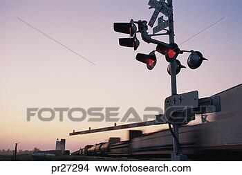 Stock Photo - train moving past 
crossing tracks, 
motion blur. fotosearch 
- search stock 
photos, pictures, 
images, and photo 
clipart
