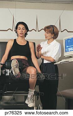 Stock Image - woman with aide 
in physical therapy. 
fotosearch - search 
stock photos, 
pictures, images, 
and photo clipart