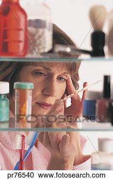 Stock Photography - woman in medicine 
cabinet. fotosearch 
- search stock 
photos, pictures, 
images, and photo 
clipart