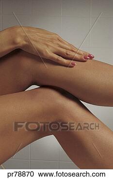 Stock Photography - woman's hands 
on leg. fotosearch 
- search stock 
photos, pictures, 
images, and photo 
clipart