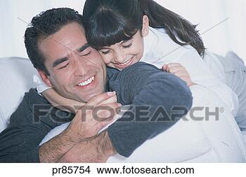 Stock Photo - father and daughter 
hugging. fotosearch 
- search stock 
photos, pictures, 
images, and photo 
clipart