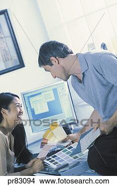 Stock Photo - man and woman 
looking at color 
samples. fotosearch 
- search stock 
photos, pictures, 
images, and photo 
clipart