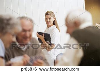 Stock Photo - seniors playing 
cards at assisted 
living facility. 
fotosearch - search 
stock photos, 
pictures, images, 
and photo clipart