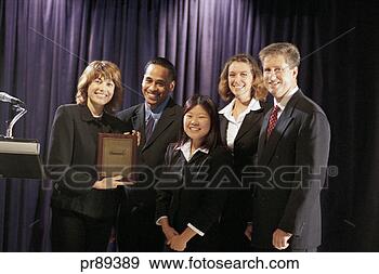 Stock Photograph - group receiving 
award, portrait. 
fotosearch - search 
stock photos, 
pictures, images, 
and photo clipart