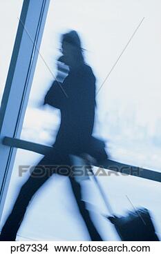 Stock Photo - man at airport, 
motion blur. fotosearch 
- search stock 
photos, pictures, 
images, and photo 
clipart