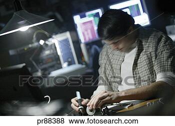 Stock Photo - man repairing 
computer. fotosearch 
- search stock 
photos, pictures, 
images, and photo 
clipart