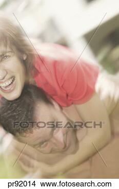Stock Photo - couple outdoors, 
blurred. fotosearch 
- search stock 
photos, pictures, 
images, and photo 
clipart