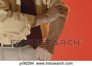 Stock Photo - man rolling up 
shirt sleeve. 
fotosearch - search 
stock photos, 
pictures, images, 
and photo clipart