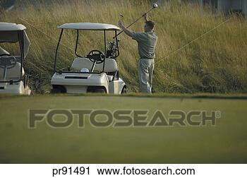 Stock Photography - man taking golf 
club out of bag. 
fotosearch - search 
stock photos, 
pictures, images, 
and photo clipart
