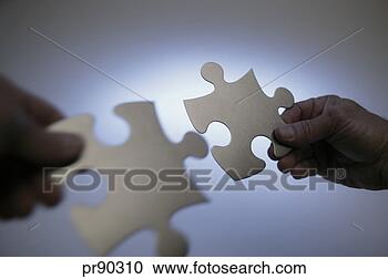 Stock Photography - person holding 
puzzle pieces. 
fotosearch - search 
stock photos, 
pictures, images, 
and photo clipart