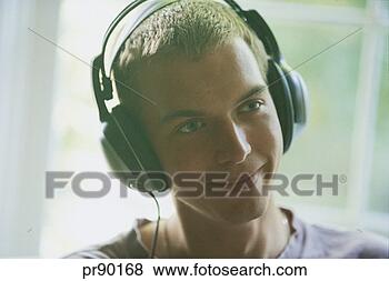 Stock Photo - teenager listening 
to music. fotosearch 
- search stock 
photos, pictures, 
images, and photo 
clipart