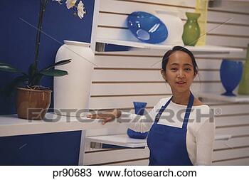 Stock Photo - teenager working 
in retail store. 
fotosearch - search 
stock photos, 
pictures, images, 
and photo clipart