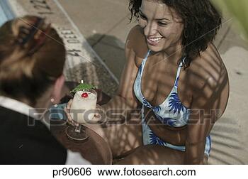 Stock Photo - waitress serving 
drinks to woman 
by pool. fotosearch 
- search stock 
photos, pictures, 
images, and photo 
clipart
