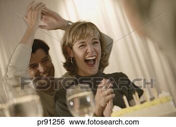 Stock Photo - woman celebrating 
her birthday. 
fotosearch - search 
stock photos, 
pictures, images, 
and photo clipart