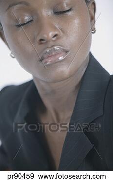 Stock Photograph - woman with eyes 
closed. fotosearch 
- search stock 
photos, pictures, 
images, and photo 
clipart