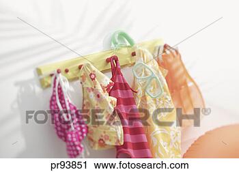 Stock Photography - bathing suits 
hanging on peg 
rack. fotosearch 
- search stock 
photos, pictures, 
images, and photo 
clipart