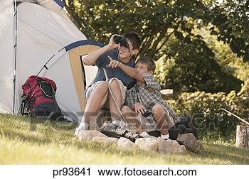 Stock Photography - boys at campground 
looking at wildlife 
with binoculars. 
fotosearch - search 
stock photos, 
pictures, images, 
and photo clipart