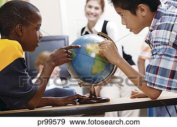Stock Photograph - boys in classroom 
with globe. fotosearch 
- search stock 
photos, pictures, 
images, and photo 
clipart