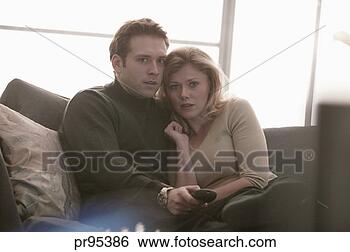 Stock Photo - couple watching 
television. fotosearch 
- search stock 
photos, pictures, 
images, and photo 
clipart