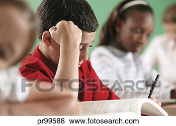 Stock Photo - little boy reading 
in classroom. 
fotosearch - search 
stock photos, 
pictures, images, 
and photo clipart
