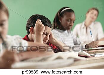 Stock Photograph - little boy reading 
in classroom. 
fotosearch - search 
stock photos, 
pictures, images, 
and photo clipart
