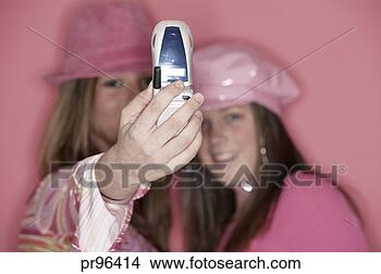 Stock Photo - teenagers taking 
photo with cell 
phone camera. 
fotosearch - search 
stock photos, 
pictures, images, 
and photo clipart