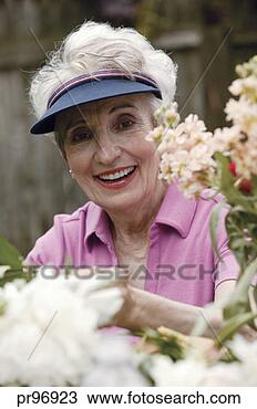 Stock Photo - woman in garden, 
portrait. fotosearch 
- search stock 
photos, pictures, 
images, and photo 
clipart
