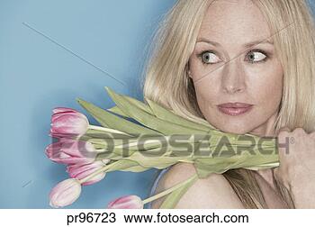 Stock Photo - woman holding 
tulips. fotosearch 
- search stock 
photos, pictures, 
images, and photo 
clipart
