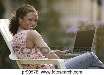 Stock Photo - woman portrait 
with laptop. fotosearch 
- search stock 
photos, pictures, 
images, and photo 
clipart