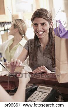 Picture - woman purchasing 
with credit card. 
fotosearch - search 
stock photos, 
pictures, images, 
and photo clipart