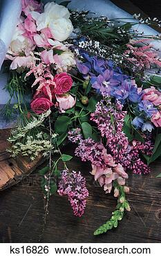 Stock Photo - assortment of 
cut flowers laying 
on table. fotosearch 
- search stock 
photos, pictures, 
images, and photo 
clipart