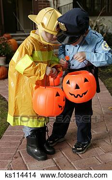 Stock Photo - boys in halloween 
costumes eating 
candy. fotosearch 
- search stock 
photos, pictures, 
images, and photo 
clipart