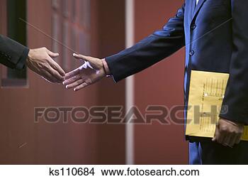 Stock Photo - businessmen shaking 
hands. fotosearch 
- search stock 
photos, pictures, 
images, and photo 
clipart