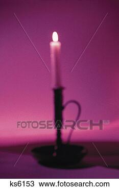 Stock Photo - candle placed 
in candle holder. 
fotosearch - search 
stock photos, 
pictures, images, 
and photo clipart