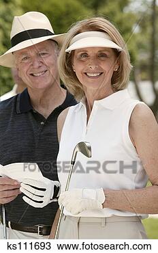 Stock Photo - couple with golf 
equipment, portrait. 
fotosearch - search 
stock photos, 
pictures, images, 
and photo clipart