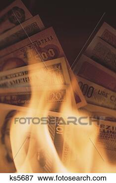 Picture - currency and flames. 
fotosearch - search 
stock photos, 
pictures, images, 
and photo clipart