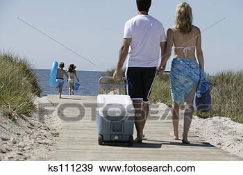 Stock Photograph - family at beach. 
fotosearch - search 
stock photos, 
pictures, images, 
and photo clipart