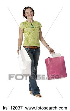 Picture - girl carrying 
shopping bags. 
fotosearch - search 
stock photos, 
pictures, images, 
and photo clipart