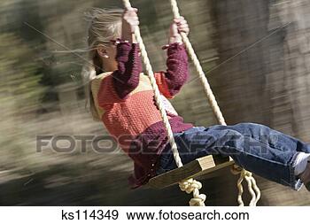 Stock Photograph - girl swinging, 
motion blur. fotosearch 
- search stock 
photos, pictures, 
images, and photo 
clipart
