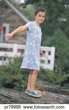 Stock Photograph - girl walking on 
tree trunk. fotosearch 
- search stock 
photos, pictures, 
images, and photo 
clipart