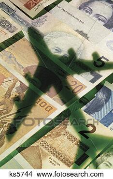 Stock Photo - international 
currency with 
shadow of airplane. 
fotosearch - search 
stock photos, 
pictures, images, 
and photo clipart
