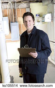 Stock Photo - man inspecting 
basement of home, 
portrait. fotosearch 
- search stock 
photos, pictures, 
images, and photo 
clipart