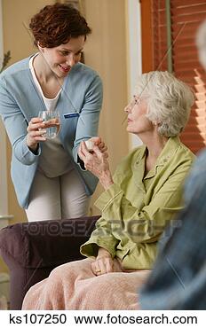 Stock Photography - medical worker 
giving woman medicine. 
fotosearch - search 
stock photos, 
pictures, images, 
and photo clipart